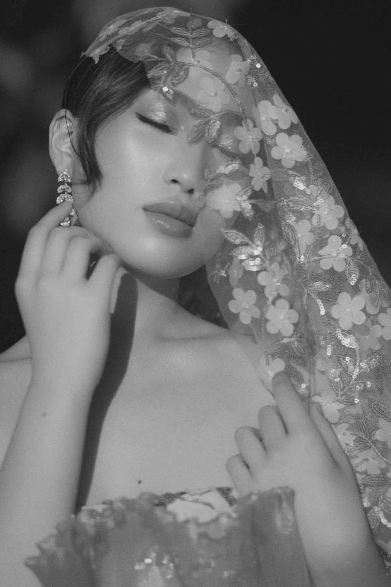 A black and white portrait of Shamira in lace