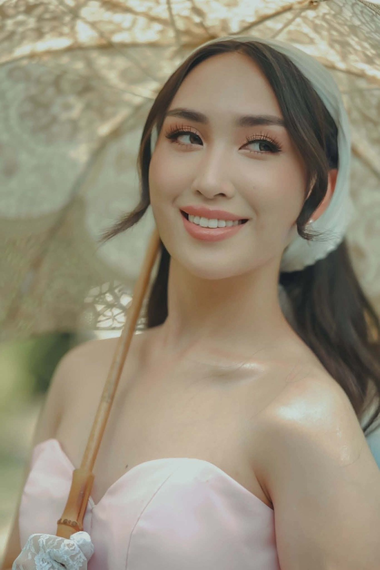 Shamira smiling softly in the garden