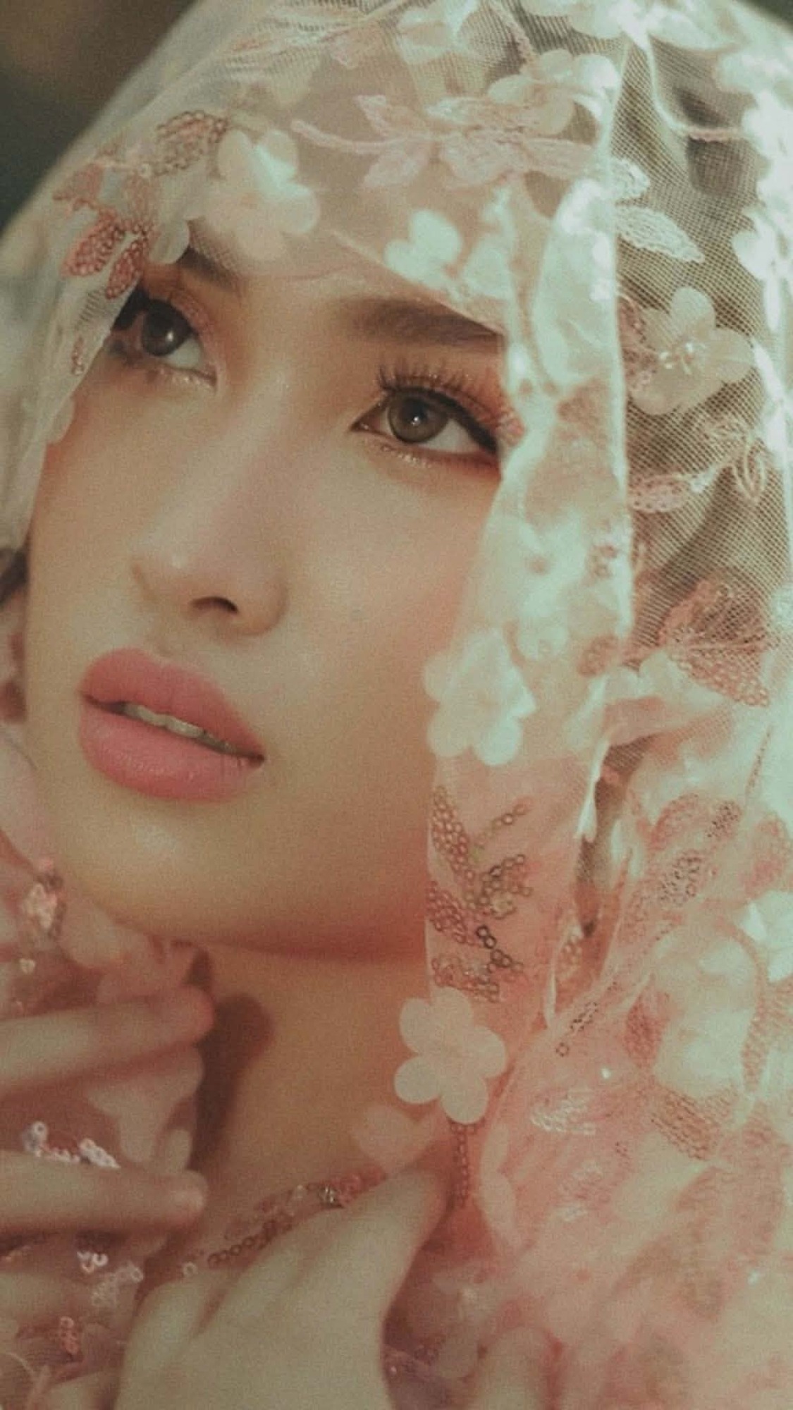 Shamira behind delicate lace